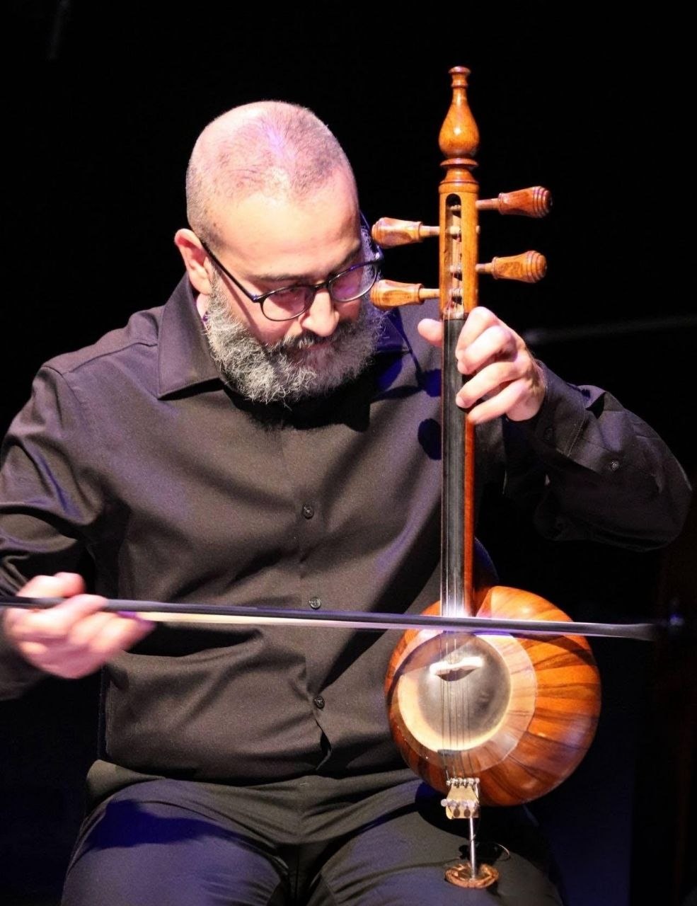 Mohammad Amini performing on kamancheh